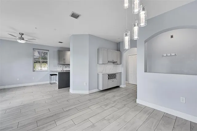 a view of a kitchen with a stove cabinets and wooden floor