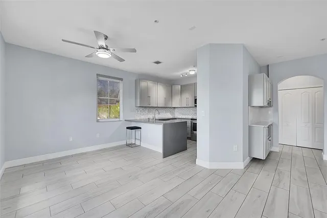 a view of kitchen with cabinets and wooden floor