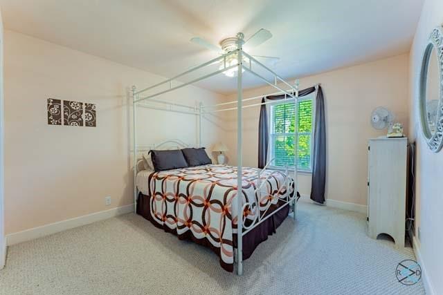 6209 Point La Vista Road Malakoff, TX 75148 - Photo 21 of 38 a bed sitting in a spacious bedroom next to a window