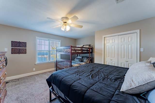 6209 Point La Vista Road Malakoff, TX 75148 - Photo 23 of 38 a bedroom with a bed and a chandelier