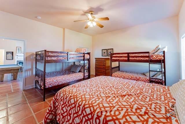 6209 Point La Vista Road Malakoff, TX 75148 - Photo 27 of 38 a bedroom with a bed and a dresser with the bathroom