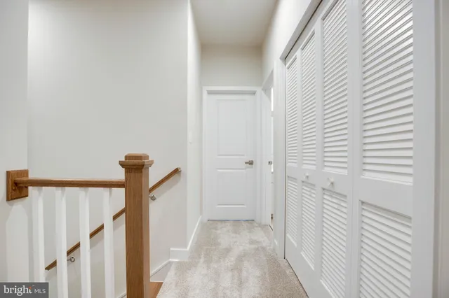 a view of a hallway with a white door
