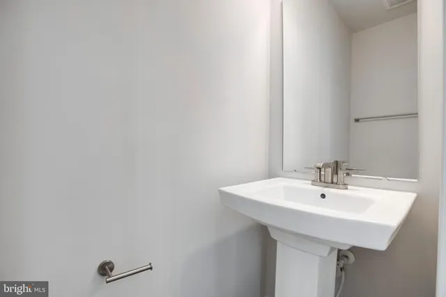 a sink with a mirror