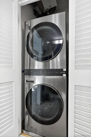 a bathroom with a sink double vanity and a shower