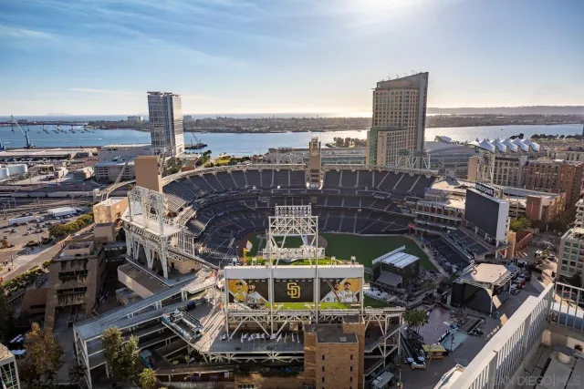 a view of roof deck with seating space and city view