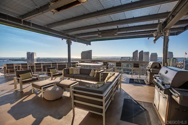 a living room with kitchen island furniture and a large window