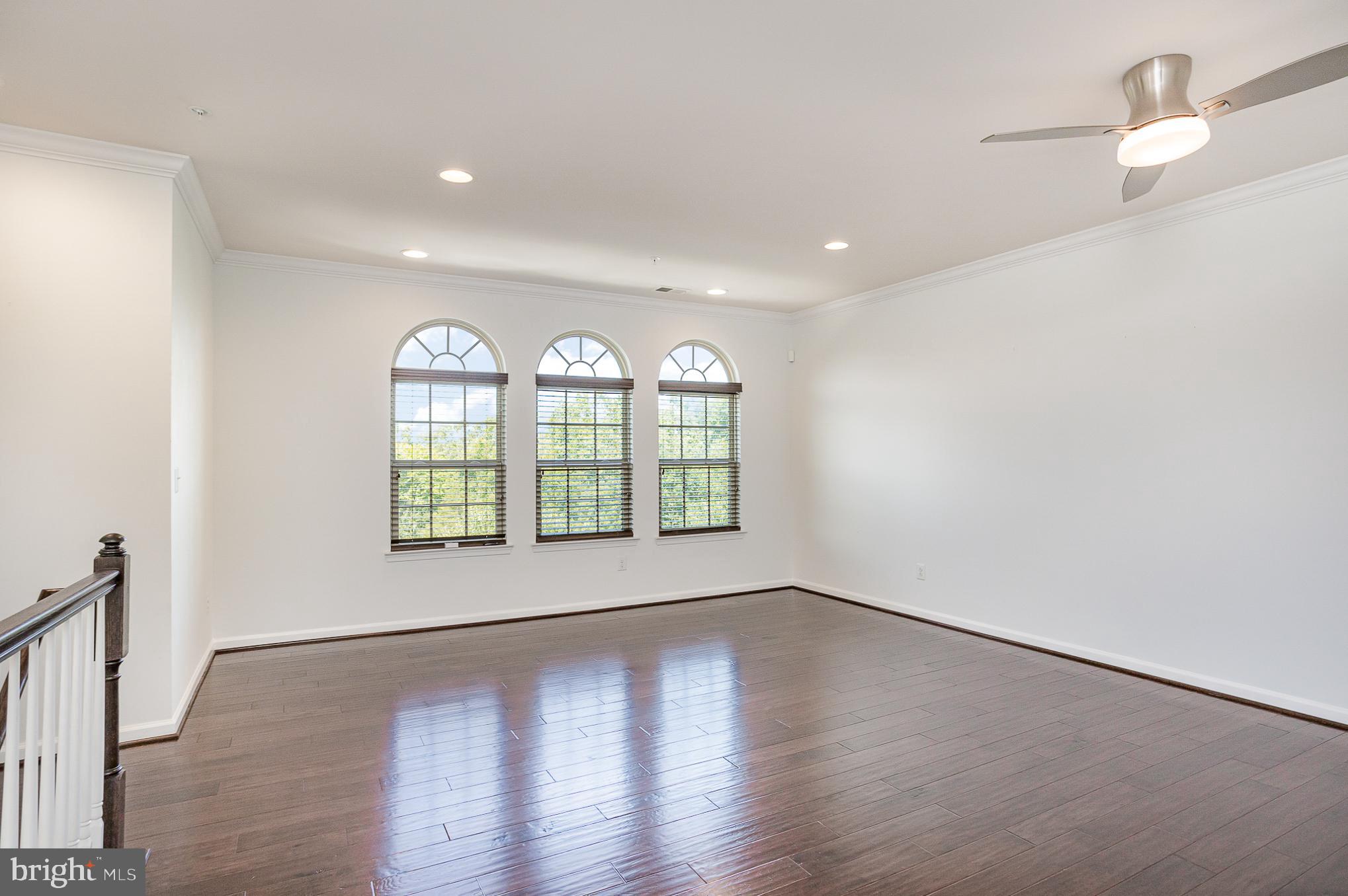 25890 Racing Sun Drive Aldie, VA 20105 - Photo 10 of 25 an empty room with wooden floor and windows