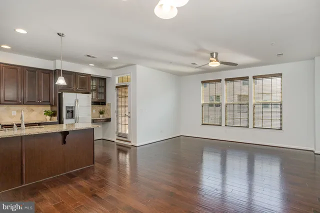 a view of kitchen with cabinets and wooden floor
