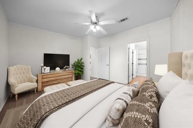 a spacious bathroom with a granite countertop sink a toilet and a mirror