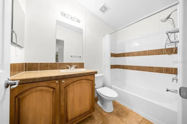 a view of swimming pool with a patio