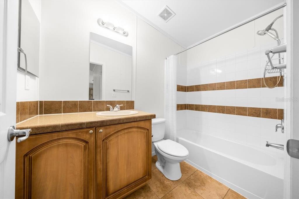 17355 Southeast 260th Avenue Road Umatilla, FL 32784 - Photo 30 of 69 a bathroom with a sink toilet and shower