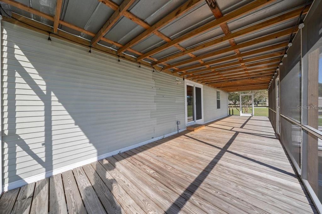 17355 Southeast 260th Avenue Road Umatilla, FL 32784 - Photo 35 of 69 a view of balcony with wooden floor
