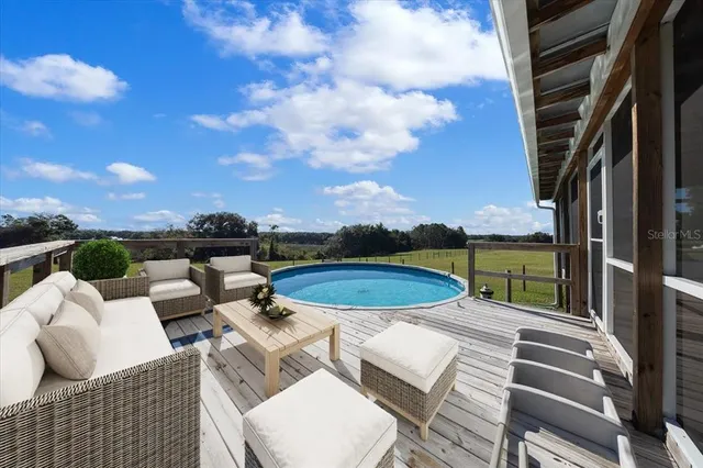 a view of house with outdoor space and seating