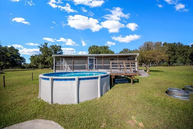 an aerial view of ocean with residential houses with outdoor space
