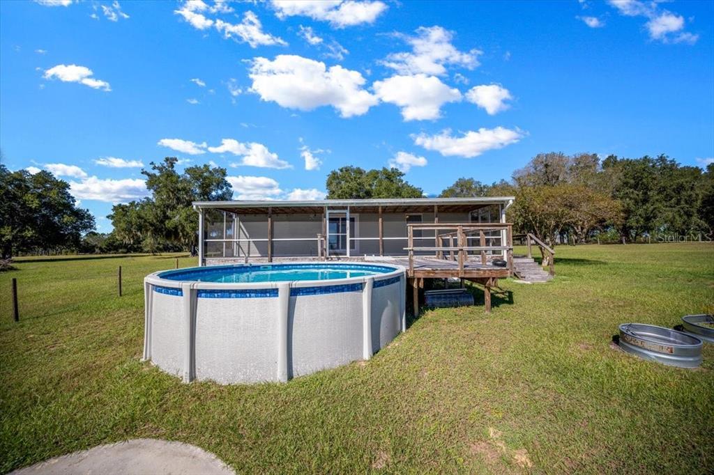 17355 Southeast 260th Avenue Road Umatilla, FL 32784 - Photo 40 of 69 a view of house with outdoor space and seating