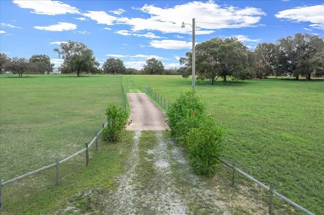 a view of a playground with basketball court