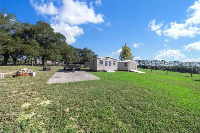 a view of a lake with a big yard
