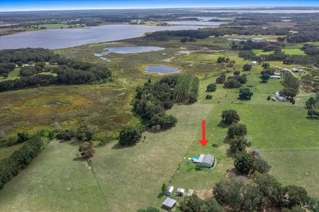 a view of an chairs and table in the backyard