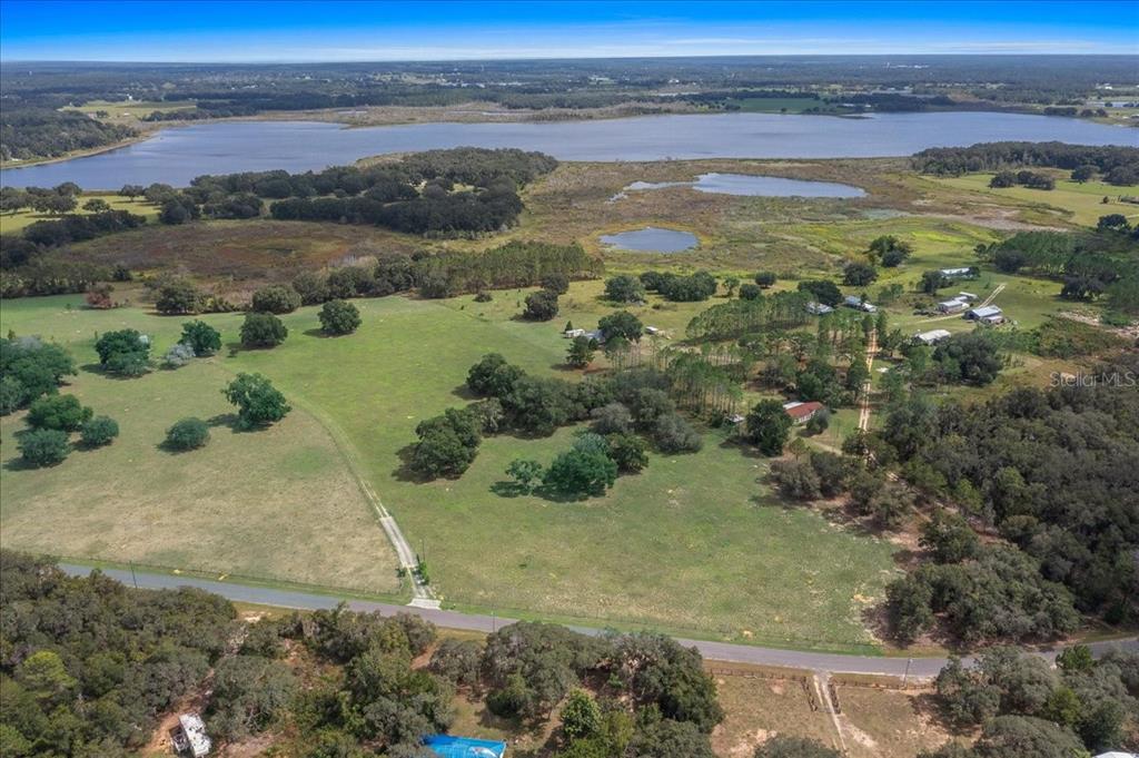 17355 Southeast 260th Avenue Road Umatilla, FL 32784 - Photo 49 of 69 an aerial view of ocean with residential houses with outdoor space