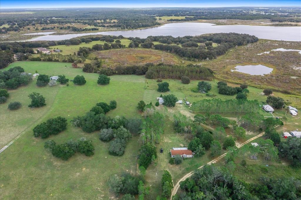 17355 Southeast 260th Avenue Road Umatilla, FL 32784 - Photo 60 of 69 an aerial view of river residential houses with outdoor space and river