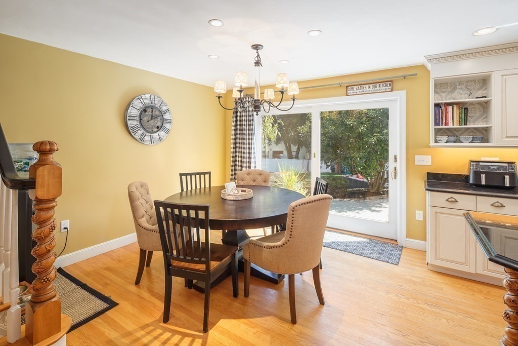 29 Anne Road North Andover, MA 01845 - Photo 14 of 31 a dining room with furniture a window and a chandelier