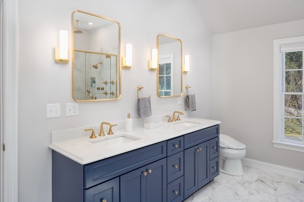 29 Anne Road North Andover, MA 01845 - Photo 18 of 31 a bathroom with a toilet sink and mirror