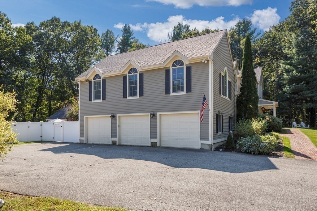 29 Anne Road North Andover, MA 01845 - Photo 30 of 31 a view of a white house with a yard and large tree