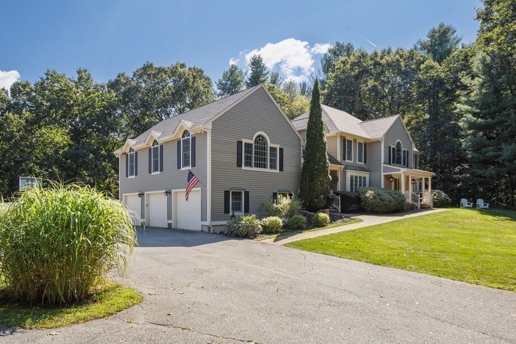 29 Anne Road North Andover, MA 01845 - Photo 31 of 31 a front view of a house with a yard and trees