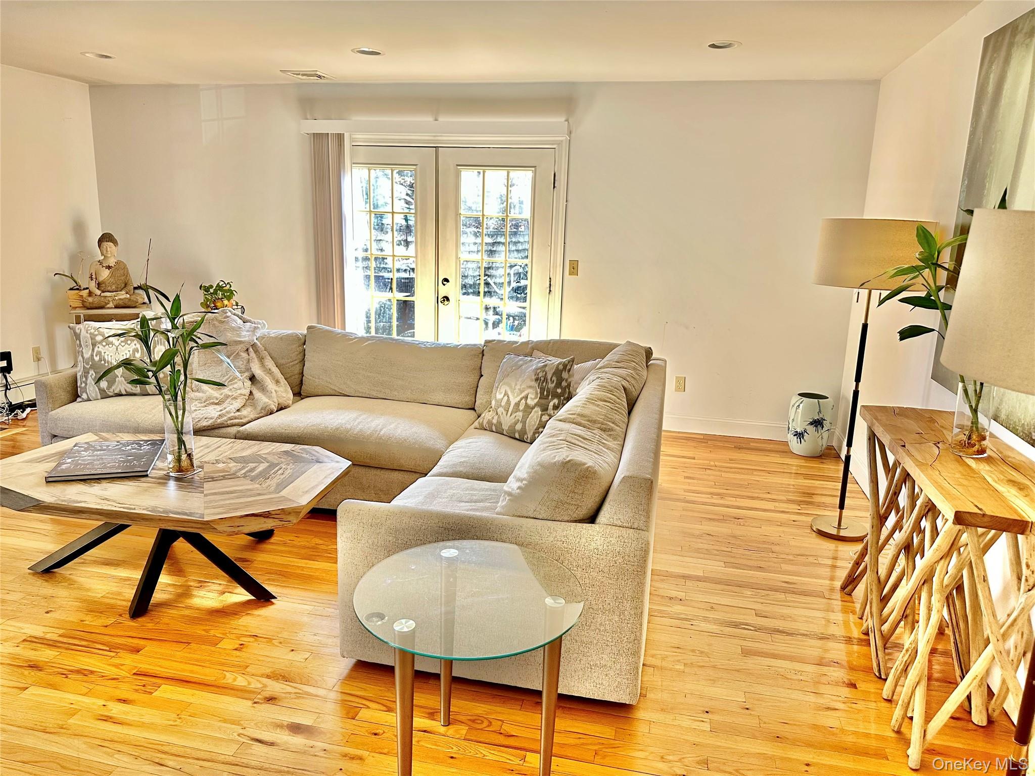 37 Hickory Road, Unit A Port Washington, NY 11050 - Photo 4 of 12 a living room with furniture and a large window