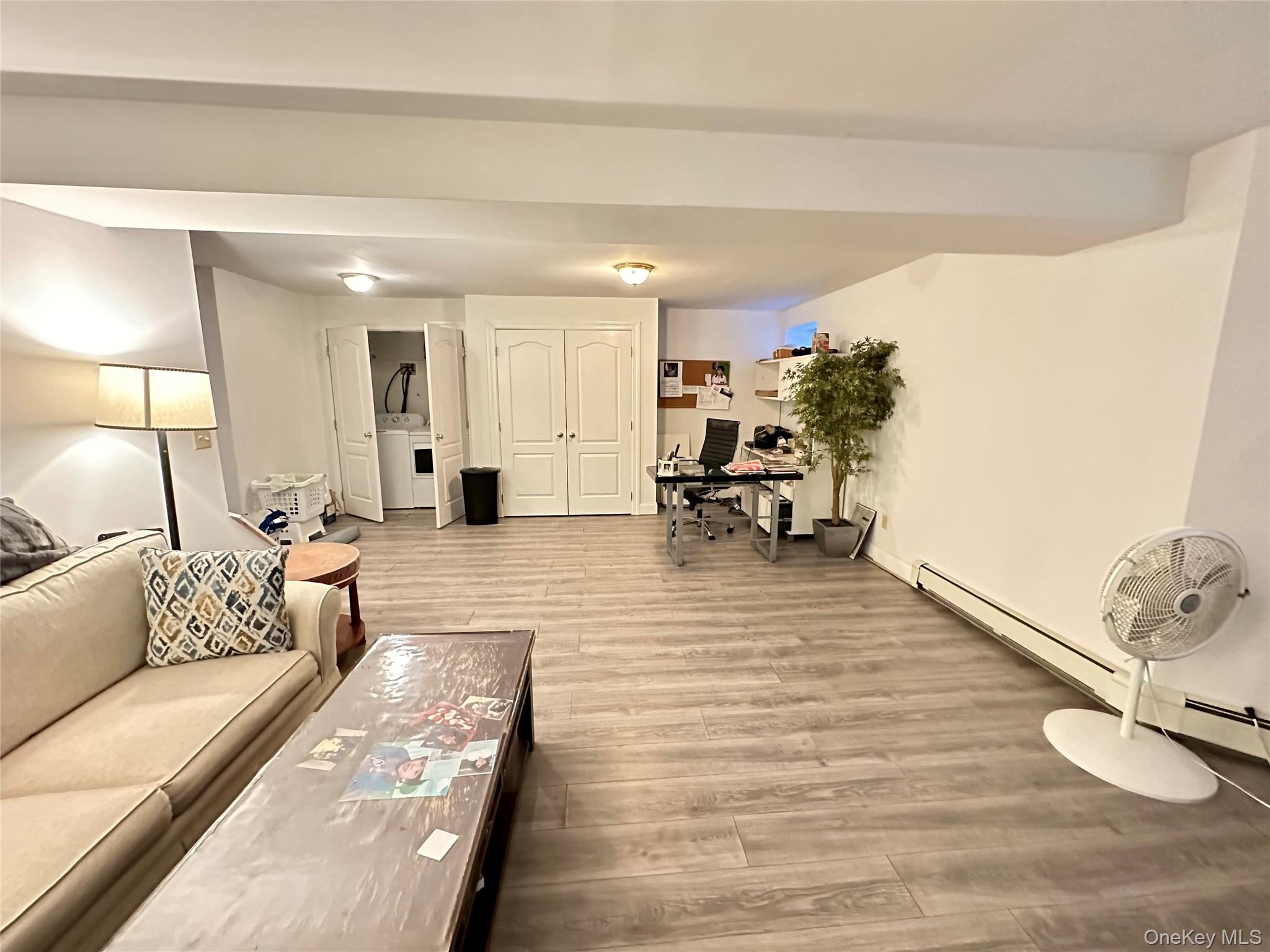 37 Hickory Road, Unit A Port Washington, NY 11050 - Photo 8 of 12 a living room with furniture and a wooden floor