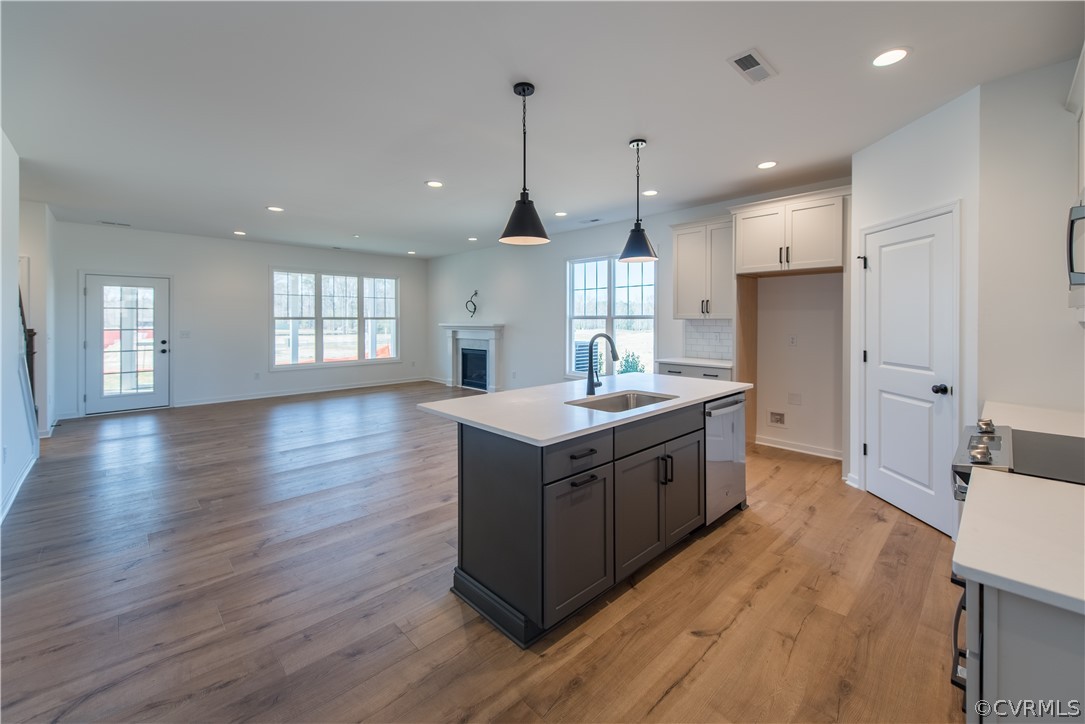 9442 Widthby Road Chesterfield, VA 23832 - Photo 6 of 21 a kitchen with a stove and a sink