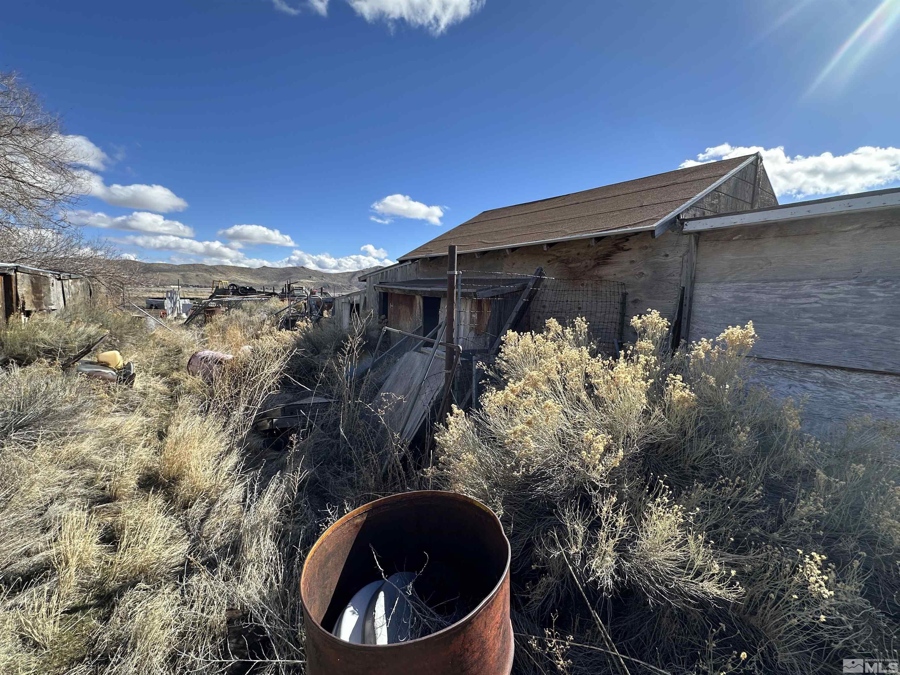 17605 West Aspen Circle Reno, NV 89508 - Photo 12 of 19 a view of a house with a small yard and wooden fence