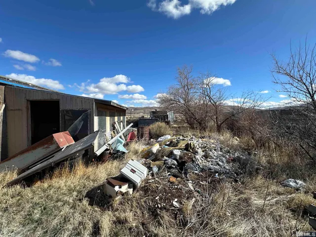 a view of a house with a pool yard fire pit and outdoor seating