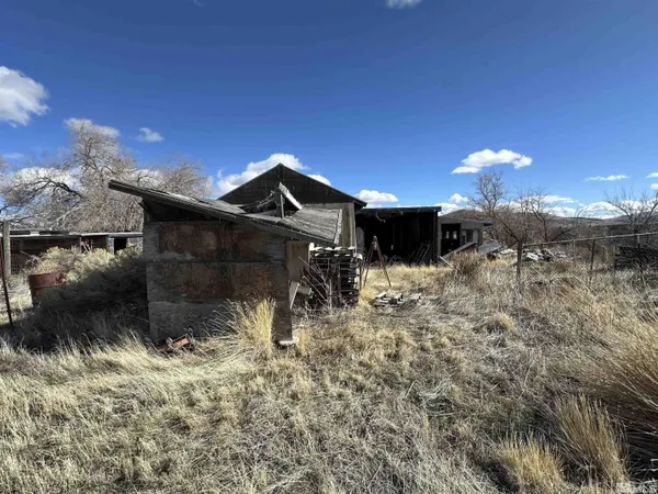 a view of a backyard of the house