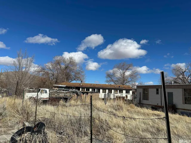 a view of a swimming pool with a table and chairs