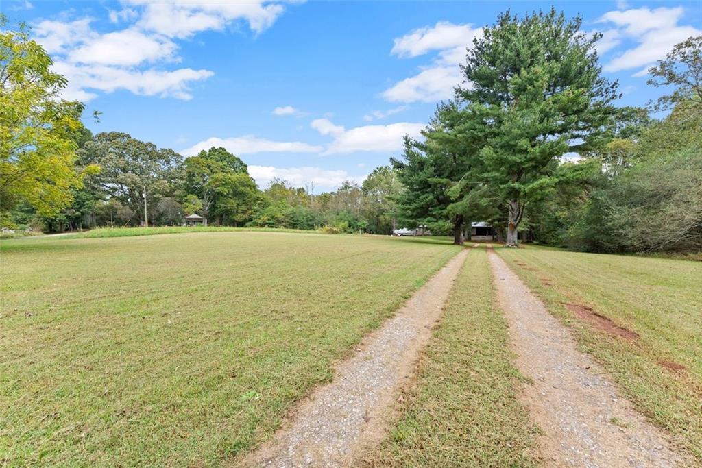 6668 Belton Bridge Road Lula, GA 30554 - Photo 10 of 20 a view of an outdoor space and a lake view