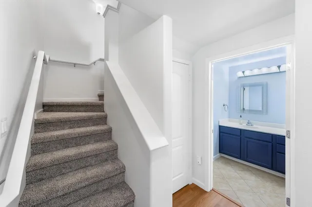 a view of entryway with wooden floor and stairs