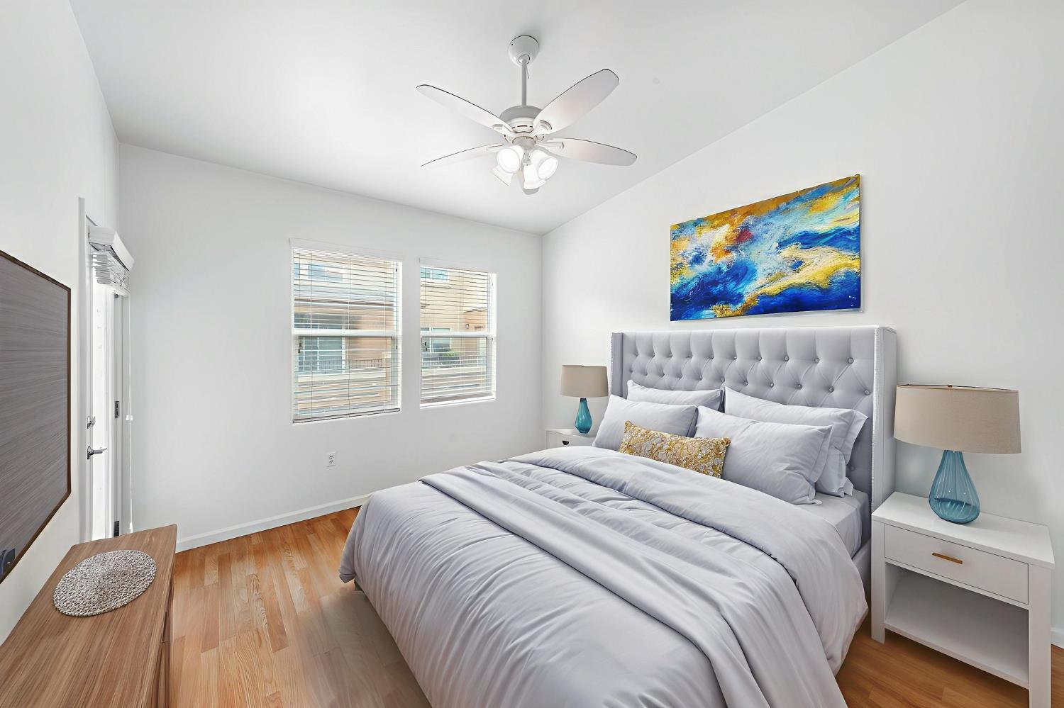 1900 Danbrook Drive, Unit 1222 Sacramento, CA 95835 - Photo 24 of 51 a bedroom with a bed and a painting on the wall