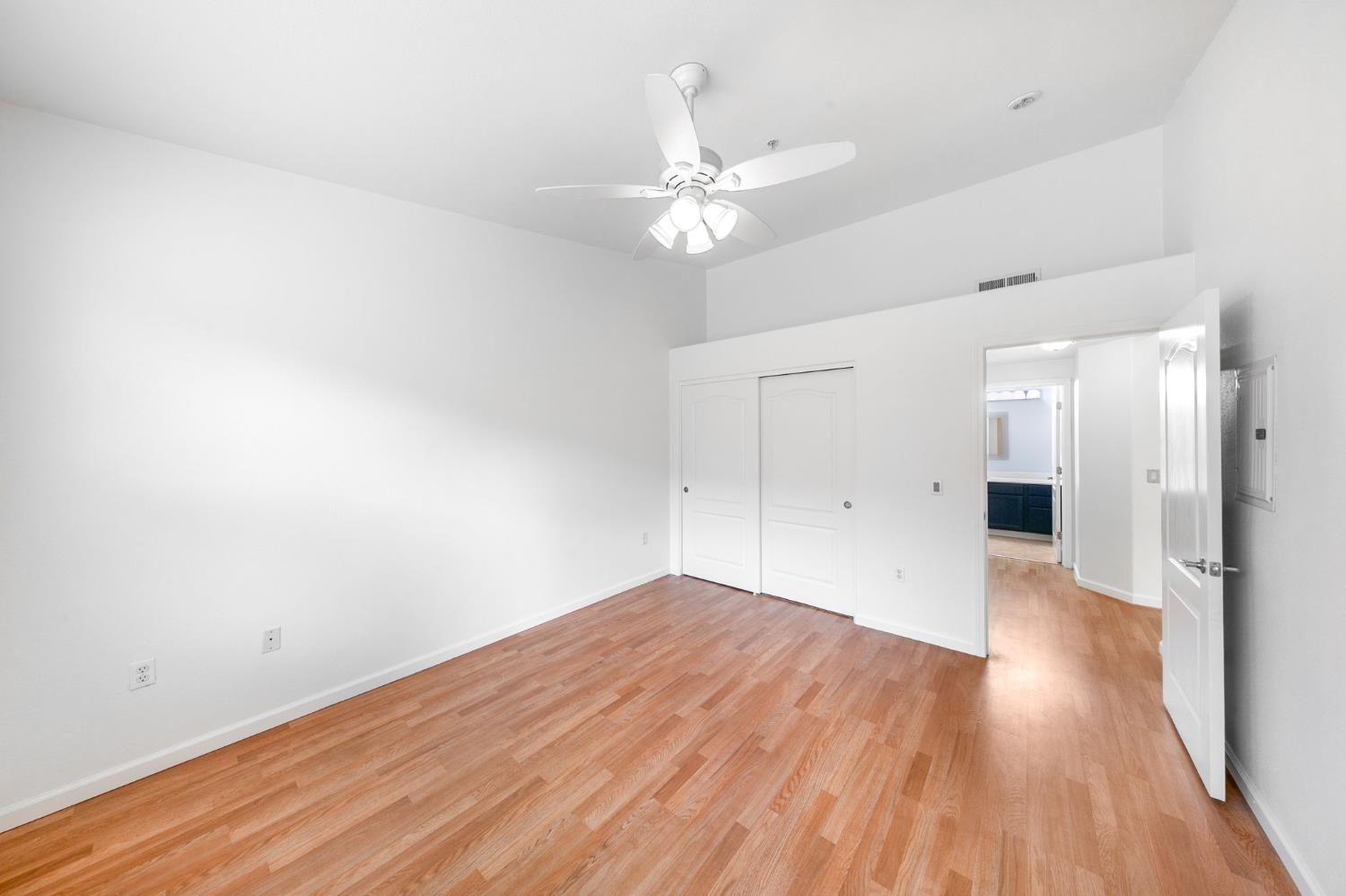 1900 Danbrook Drive, Unit 1222 Sacramento, CA 95835 - Photo 26 of 51 a view of a big room with wooden floor and a chandelier fan