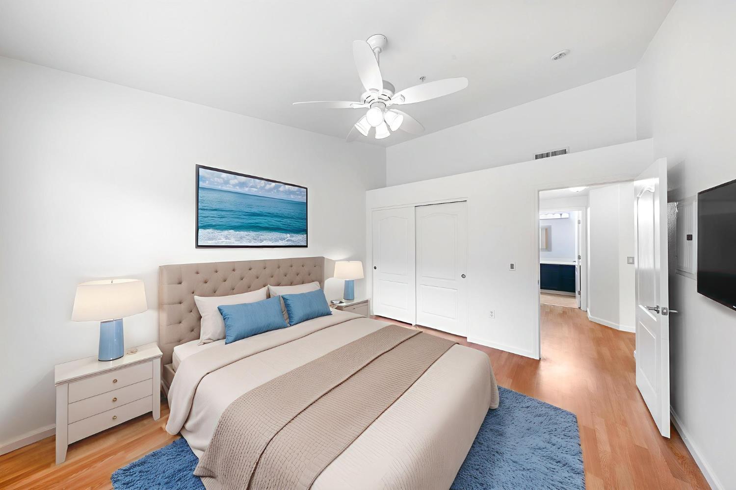 1900 Danbrook Drive, Unit 1222 Sacramento, CA 95835 - Photo 27 of 51 a bedroom with a bed and a chandelier