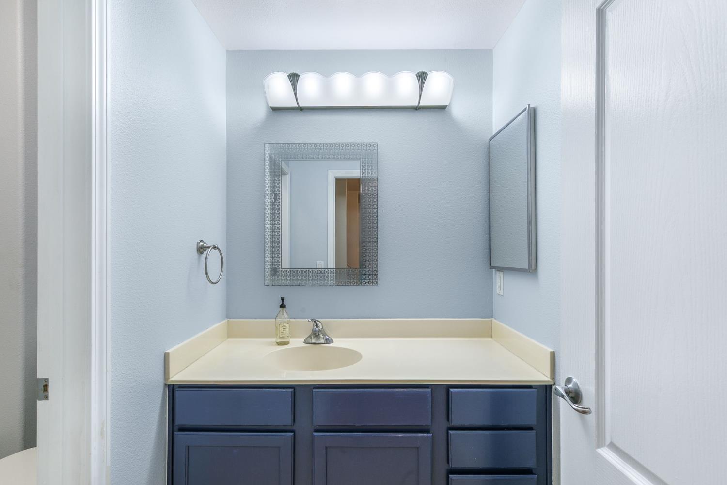 1900 Danbrook Drive, Unit 1222 Sacramento, CA 95835 - Photo 29 of 51 a bathroom with a sink and a mirror