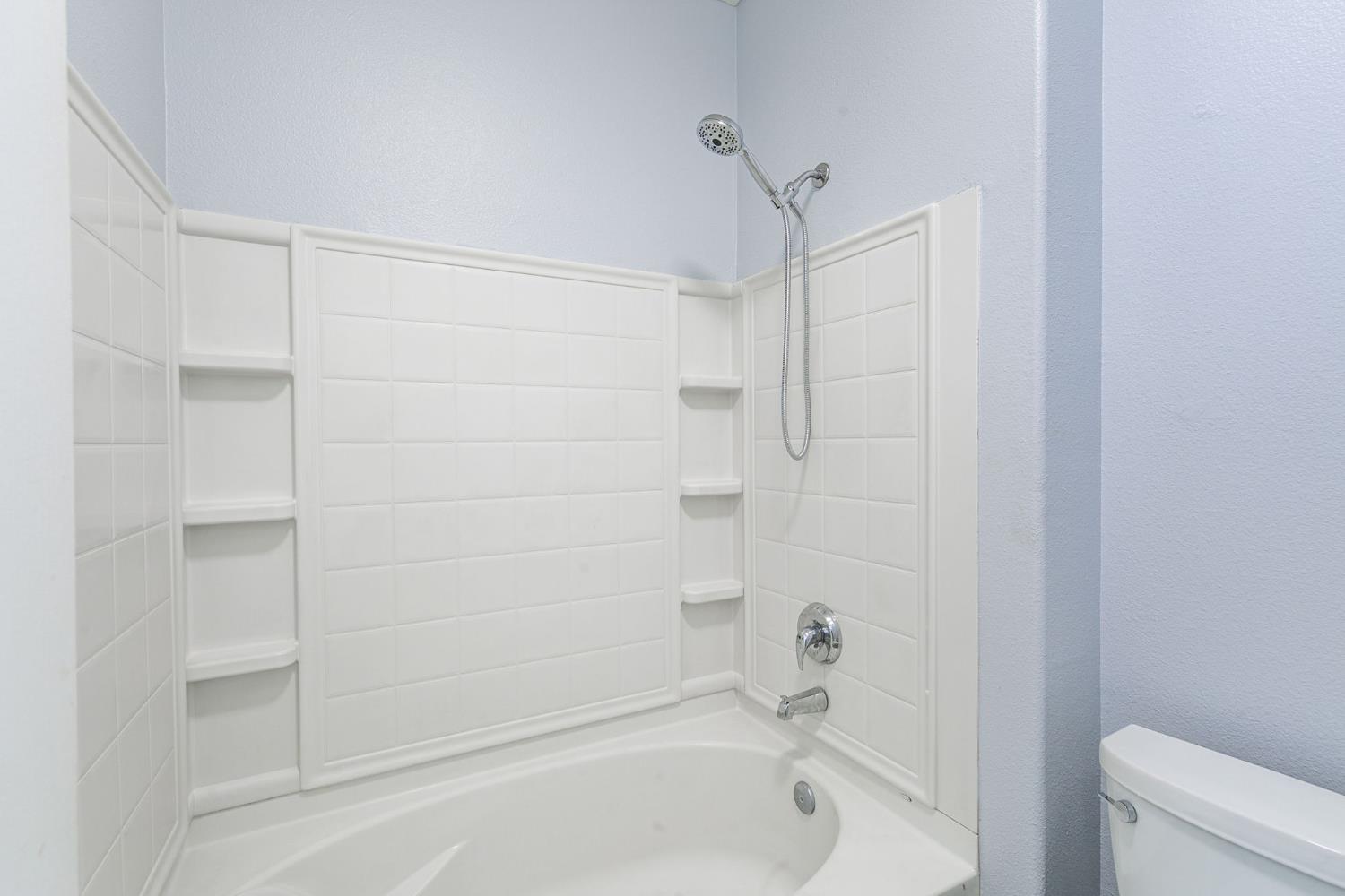 1900 Danbrook Drive, Unit 1222 Sacramento, CA 95835 - Photo 30 of 51 a bathroom with a bathtub and a shower