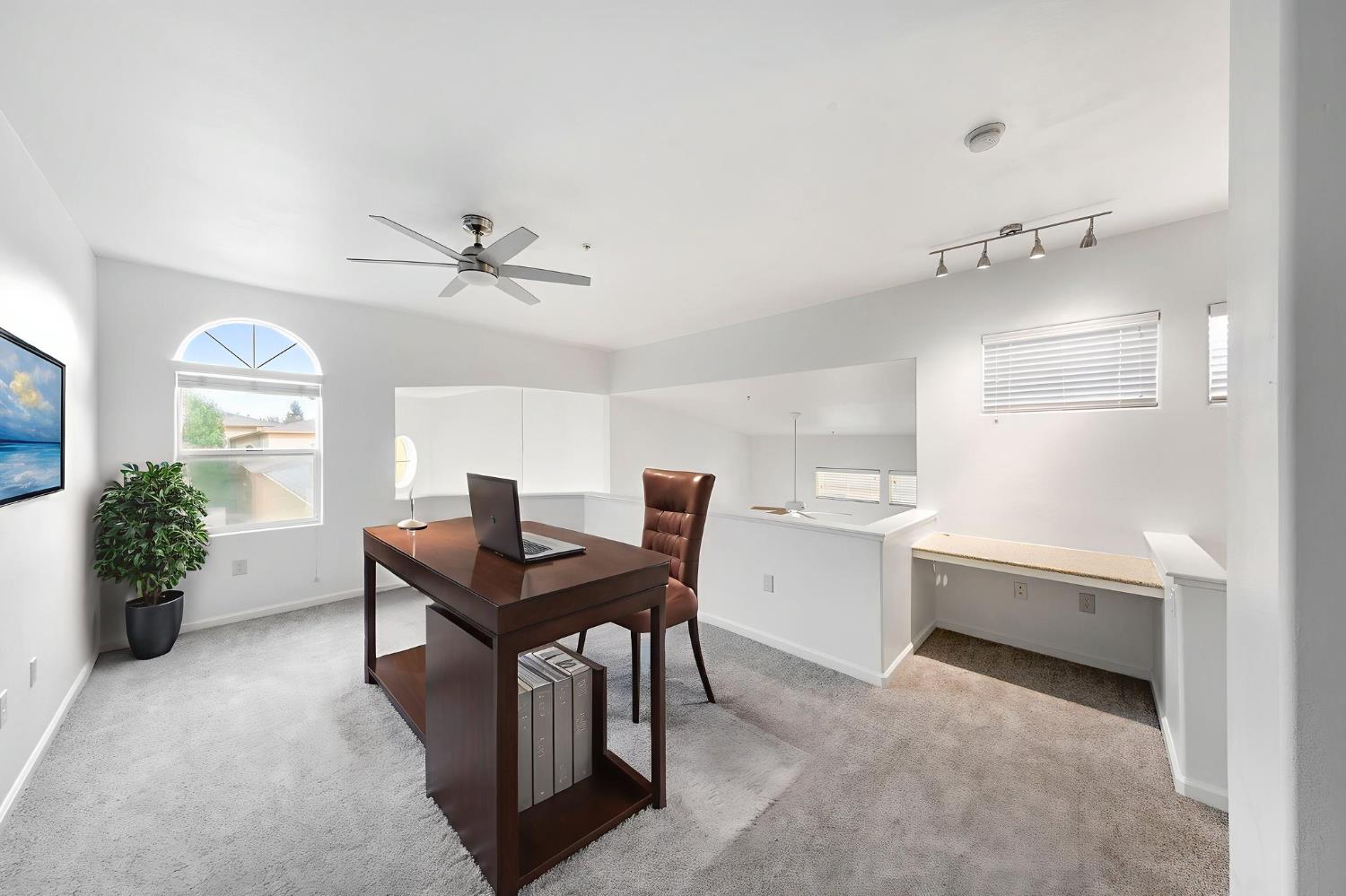 1900 Danbrook Drive, Unit 1222 Sacramento, CA 95835 - Photo 35 of 51 a view of a workspace with furniture and a window