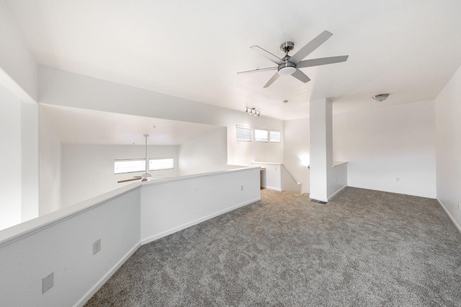 1900 Danbrook Drive, Unit 1222 Sacramento, CA 95835 - Photo 38 of 51 a view of a livingroom with a ceiling fan and window