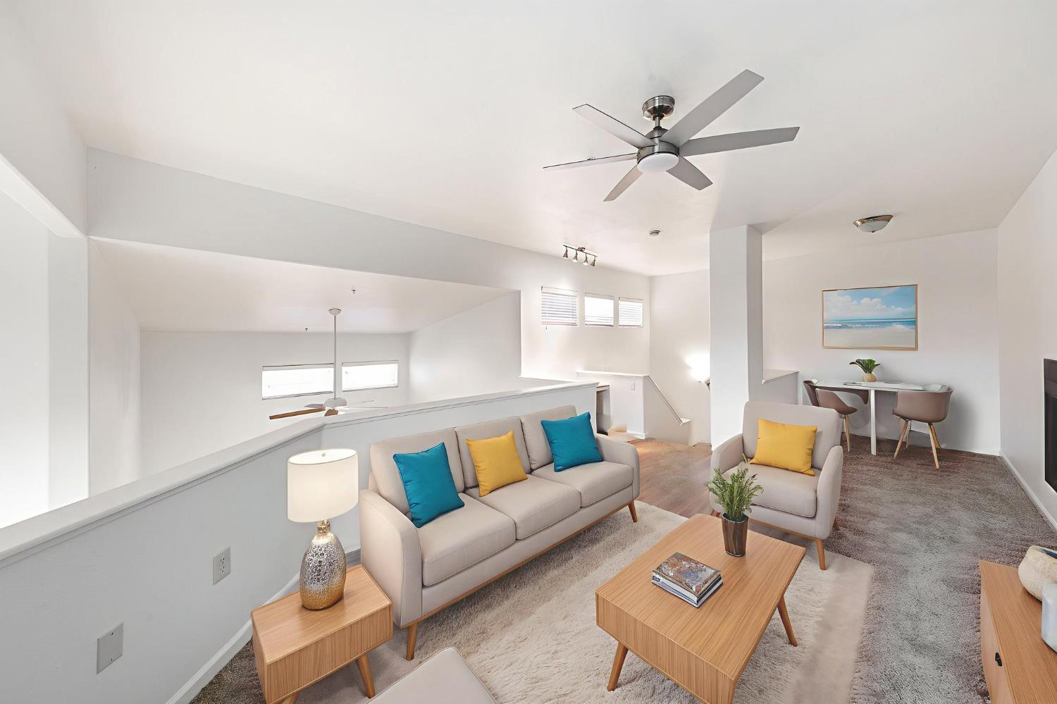 1900 Danbrook Drive, Unit 1222 Sacramento, CA 95835 - Photo 39 of 51 a living room with furniture and a chandelier