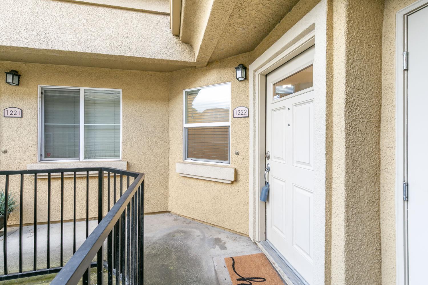 1900 Danbrook Drive, Unit 1222 Sacramento, CA 95835 - Photo 4 of 51 a view of a hallway with wooden floor and windows