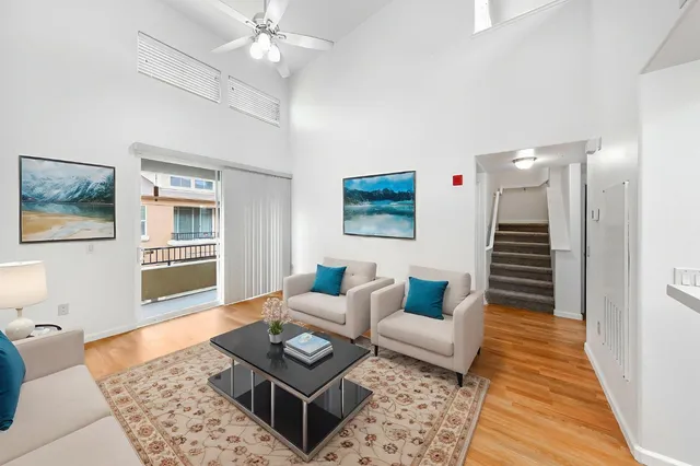 a living room with furniture and a rug