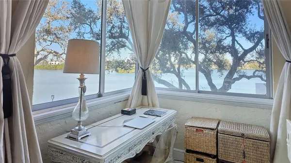 a view of hall way with furniture