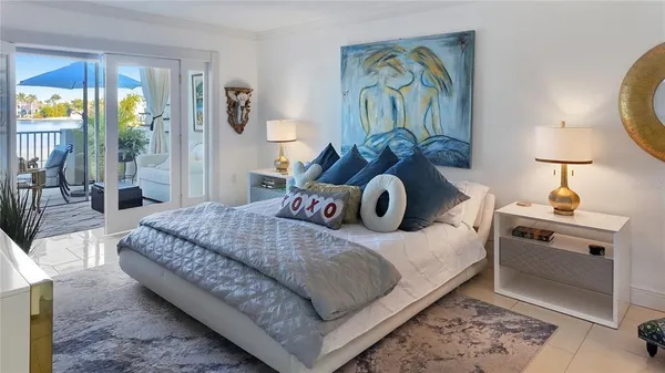 a bedroom with a bed and a lamp