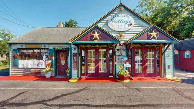 a view of water fountain in front of retail shop